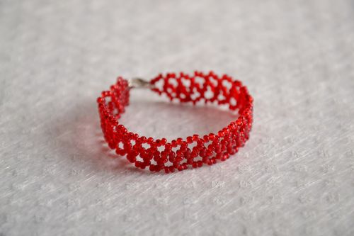 Handmade braided beaded openwork bracelet of red color present for girl - MADEheart.com