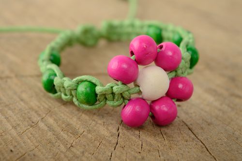 Handmade macrame bracelet woven of waxed cord and wooden beads - MADEheart.com