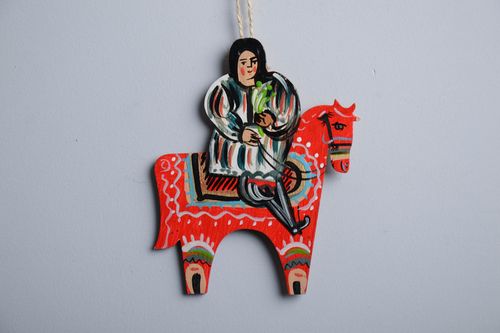 Wooden interior pendant in the shape of a guy riding a horse - MADEheart.com