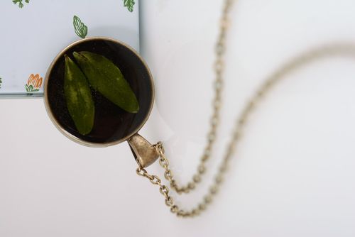 Handmade round black pendant with natural flower in epoxy resin on metal chain  - MADEheart.com