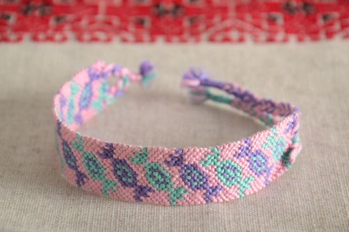 Handmade friendship wrist bracelet woven of pink and violet threads Candies - MADEheart.com