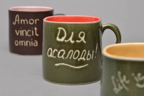 Green and orange glazed porcelain tea, coffee cup with cave drawings - MADEheart.com