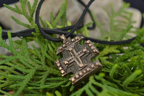 Small unusual next to skin handmade cross pendant cast of bronze on black cord - MADEheart.com