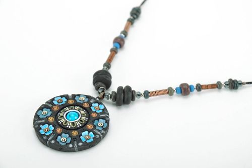 Pendant made of black smoked ceramics with turquoise - MADEheart.com