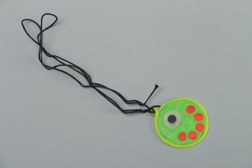 Round polymer clay pendant that glows in darkness - MADEheart.com