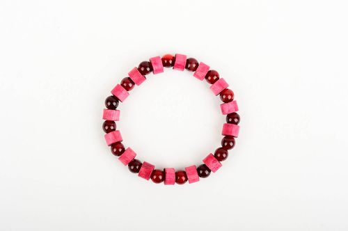 The wide wooden handmade beaded bracelet with dark red and light red beads on elastic cord - MADEheart.com