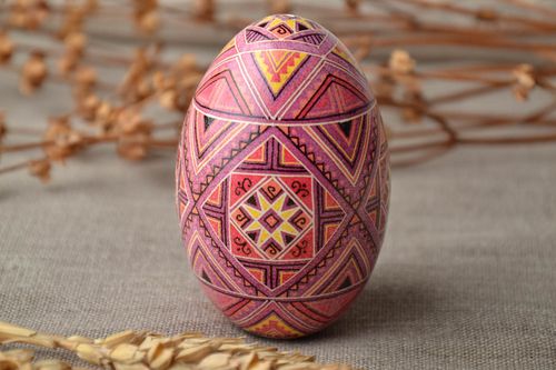 Painted Easter egg with traditional symbolics - MADEheart.com