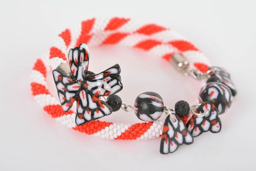Handmade white and orange beaded cord wrist bracelet with polymer clay charm - MADEheart.com