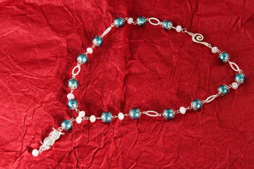 The handmade light beaded bracelet on silver string with blue beads - MADEheart.com