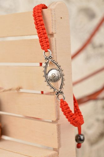 Handmade red bracelet made of silk threads with insert in shape of eye - MADEheart.com