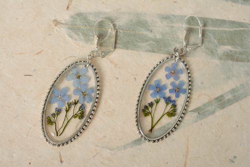 Handmade oval transparent dangle earrings with blue dried flowers in epoxy resin - MADEheart.com