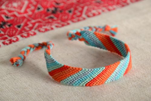 Handmade striped friendship bracelet woven of orange and blue embroidery floss - MADEheart.com