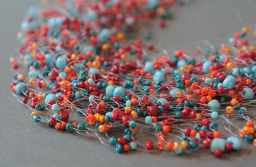 Bead necklace on a fishing line braided with crochet needle - MADEheart.com