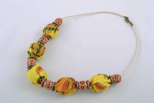 Textile necklace with wooden beads and nuts - MADEheart.com