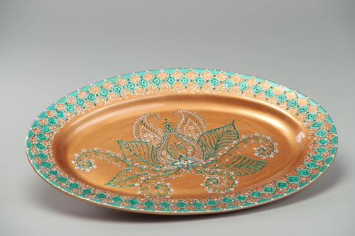 Large handmade ceramic dish of oval shape decorated with painted ornaments - MADEheart.com