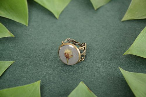 Homemade small round grey epoxy resin ring with flowers inside   - MADEheart.com