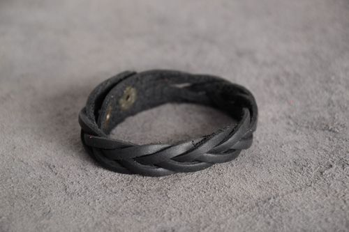 Thin handmade bracelet woven of black genuine leather with metal studs - MADEheart.com