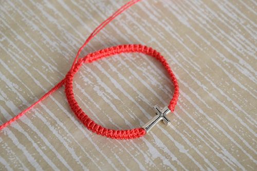 Handmade red friendship wrist bracelet woven of threads with metal cross - MADEheart.com