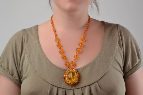 Handmade cute long pendant made of beads and natural stones of amber color - MADEheart.com