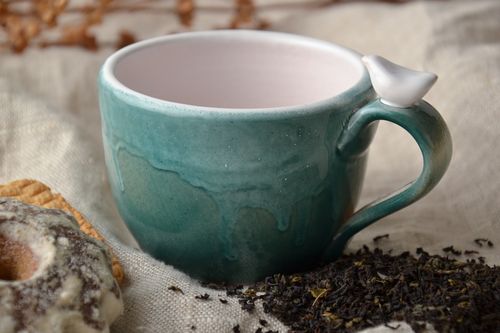Porcelain blue cup with white inside and dove figuring on the handle - MADEheart.com