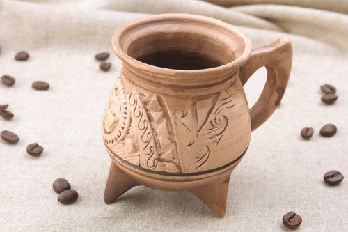 Medium size (6 oz) clay not glazed coffee cup on tree legs with handle and pattern in Mayan style - MADEheart.com