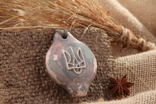 Tin whistle pendant made of clay with trident - MADEheart.com