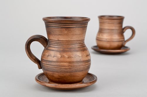 Ceramic cup in pitcher shape with handle and saucer in rustic pattern - MADEheart.com