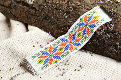 Ukrainian ornament wide beaded wrist bracelet in blue, red, and white colors - MADEheart.com