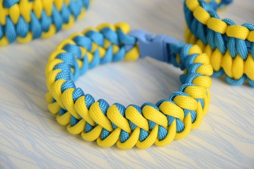 Handmade wrist survival bracelet woven of yellow and blue parachute cords - MADEheart.com