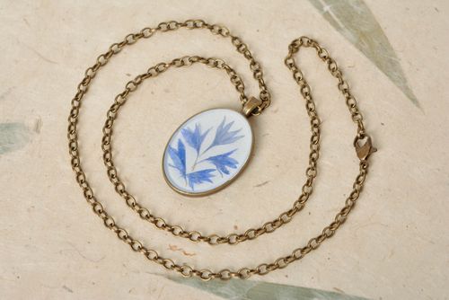 Unusual design handmade pendant with dried flowers and epoxy resin coating - MADEheart.com