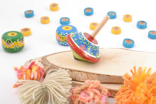 Unusual handmade wooden toy spinning top with eco painting for children - MADEheart.com