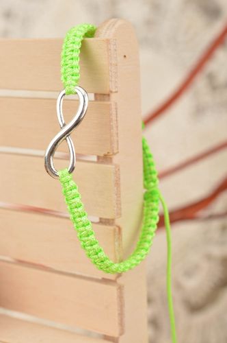 Beautiful handmade woven silk thread bracelet of lime color with metal charm - MADEheart.com