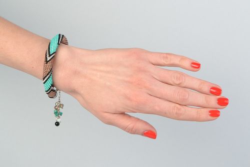 Stylish handmade beaded cord wrist bracelet with laconic two-colored ornament - MADEheart.com