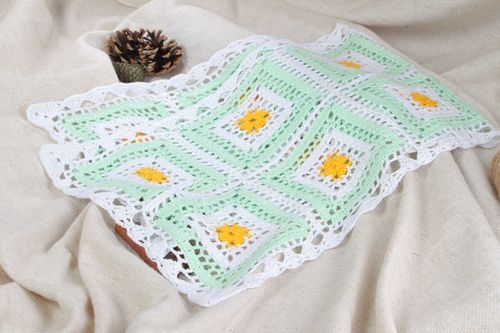 Handmade crocheted decorative napkin on the table made of cotton threads in light colors - MADEheart.com