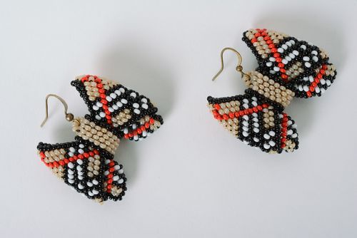 Handmade dangle earrings woven of beads beige checkered bows for girls - MADEheart.com