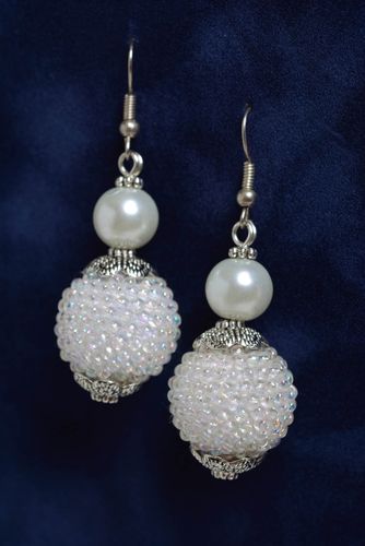 Handmade long dangling earrings with bead woven balls of snow white color - MADEheart.com