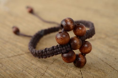 Unusual macrame bracelet of brown color with wooden beads - MADEheart.com