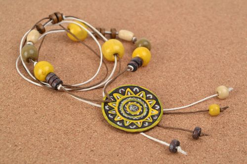 Handmade ethnic yellow and black polymer clay neck pendant on a cord with beads  - MADEheart.com