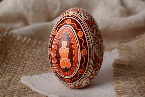 Dark red handmade painted goose egg ornamented using waxing technique  - MADEheart.com