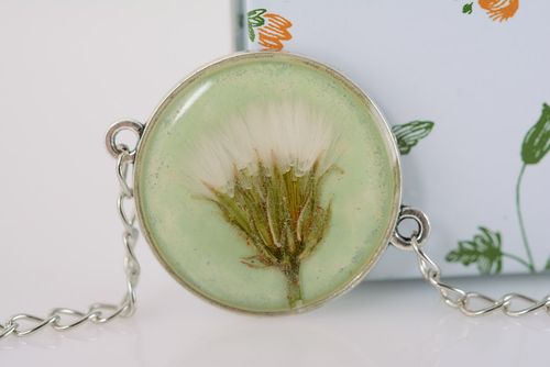 Handmade round transparent pendant with flower in epoxy resin on long metal chain - MADEheart.com