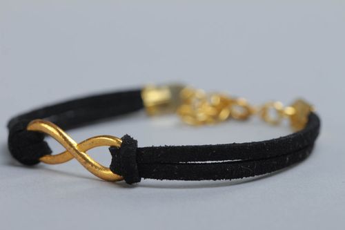 Beautiful festive handmade woven suede cord bracelet of black color with charm - MADEheart.com